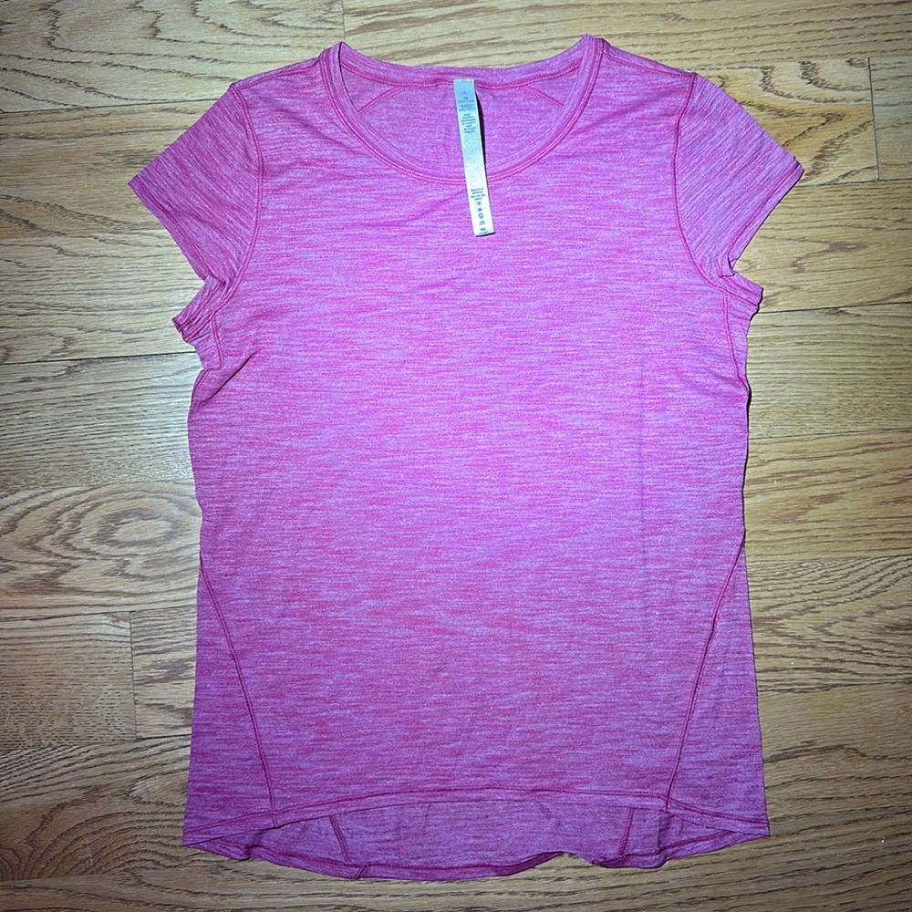 NWT. Lululemon woman’s shirt sleeve top. In red. Size 6.